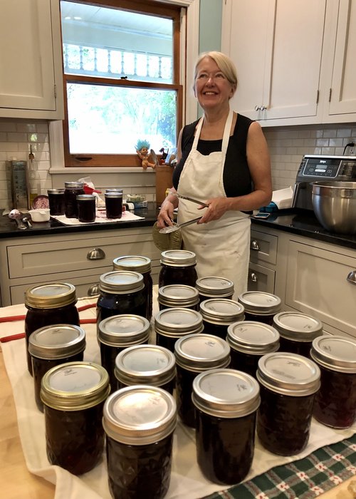 Julie in jelly Heaven. She spent a day picking grapes that her brothers had grown in Branchport a...