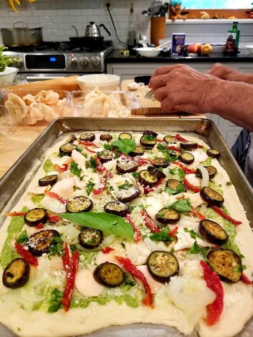 The pizza had the following ingredients: a layer of freshly made pesto sauce,&nbsp;thin slices of...