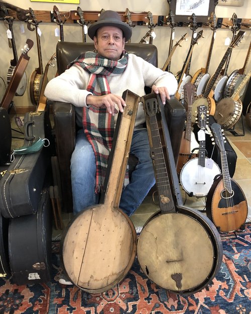 Rochester native with Rochester banjo and case.