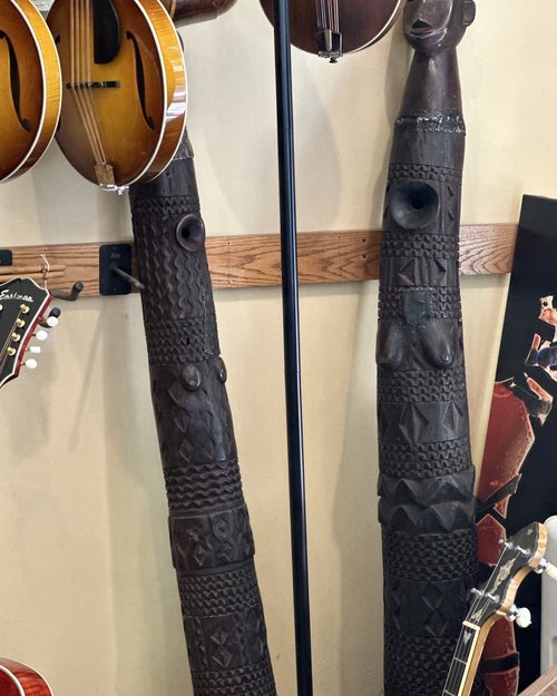 These carved ebony horns are purportedly made and used by the Massai people. Kajakne tells me the...