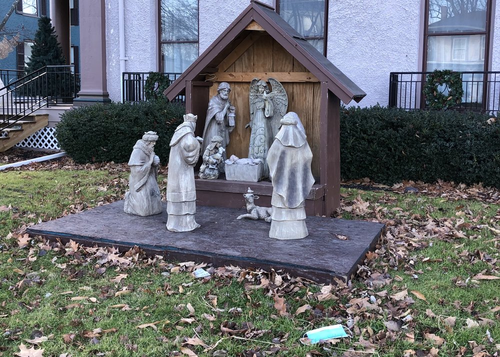 I love this little nativity scene down the street from us. Especially the lamb with a little bird...