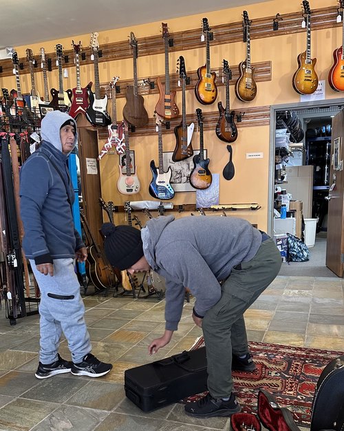 This father and son stopped in the store. They were from Ecuador and they were looking for a saxo...