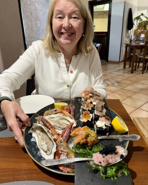 Julie enthusiastically displays a fresh seafood platter at Ci Vulia, our new favorite restaurant....