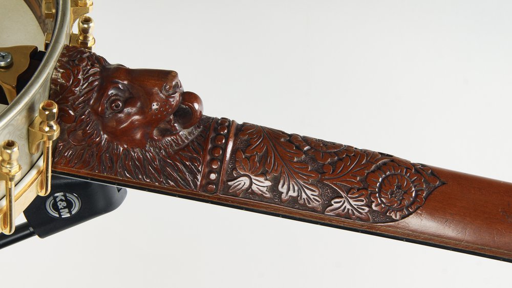 The highest grade, banjos had astounding carvings on the neck, the most famous being the lion’s head