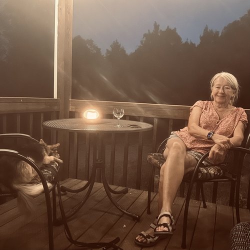 Julie and Ike on the porch on our "tin cottage"