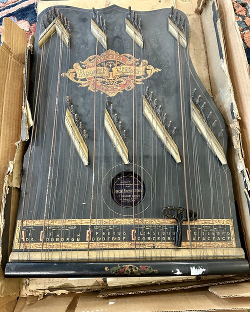 Our friend Hugh brought in this zither that he purchased in an estate sale. It bears a label from...