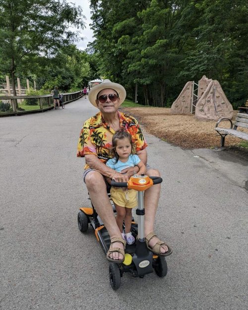 I used my mobility cart to get around the zoo and my granddaughter, Olive, just had to ride along...