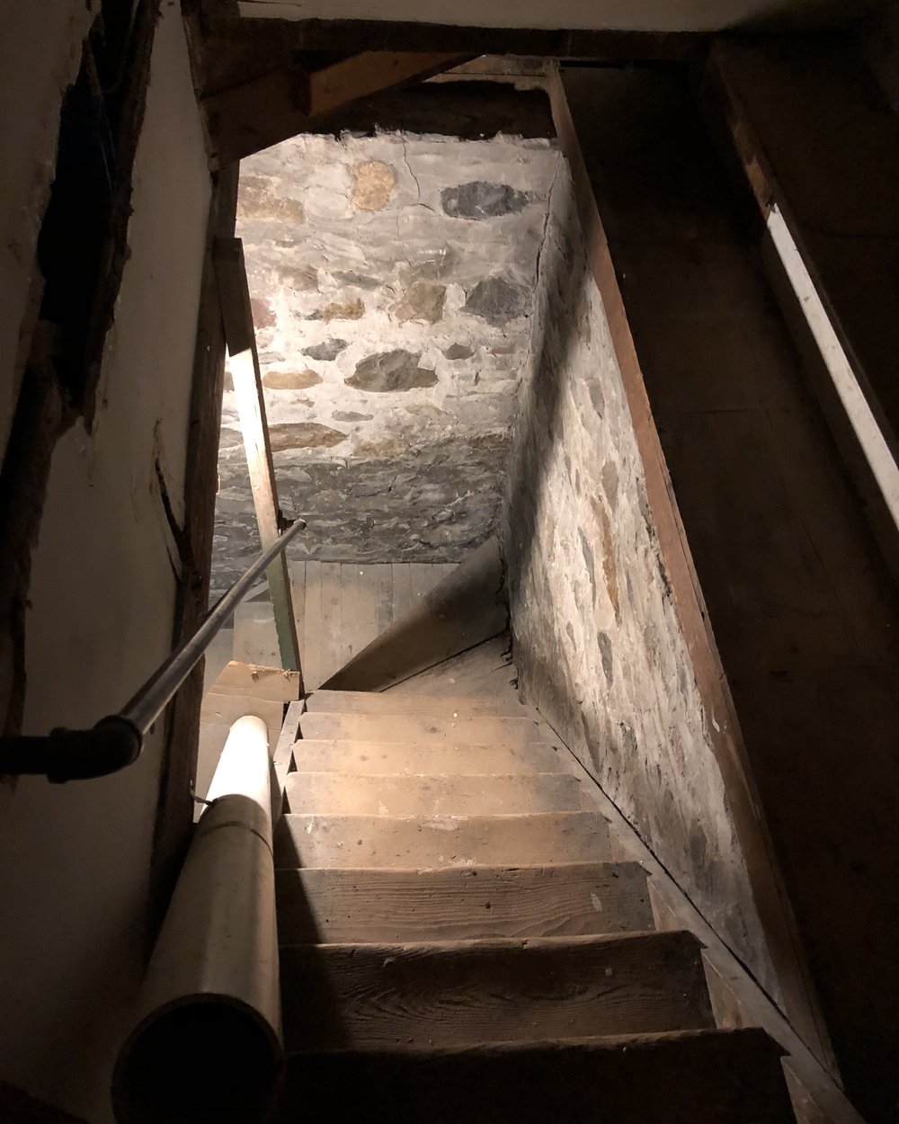 Stairs to the incredible basement which is saved for a whole separate story. It looks like a spea...